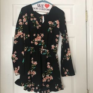 One piece floral romper perfect for any season!